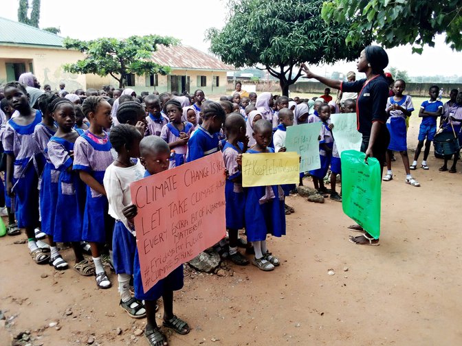 Climate activist Oladosu Adenike organising with schoolchildren in Abuja, Nigeria, 2019.