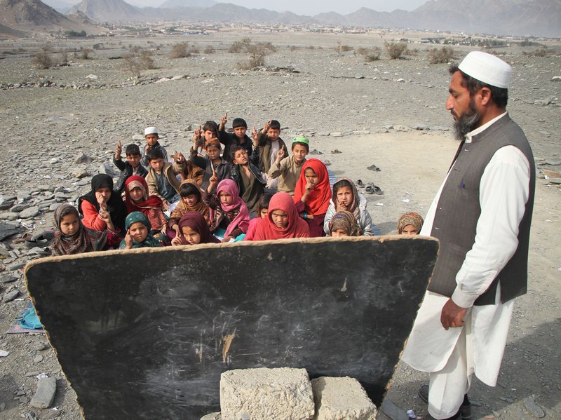 Afghan students attend a class at a local school in Nangarhar province, eastern Afghanistan, February, 2018.