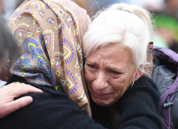 People pay their respects for the victims of the mosques attacks in Christchurch, New Zealand, March 17, 2019.