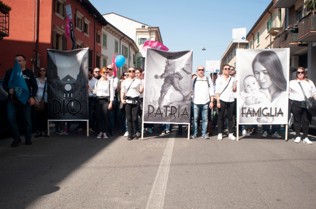 Far-right protestors with placards quoting “God, Nation, Family” at a march after the World Congress of Families in Verona, Italy | PA 