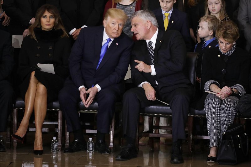 Melania Trump, Donald Trump, and Franklin Graham at his father Billy Graham’s funeral